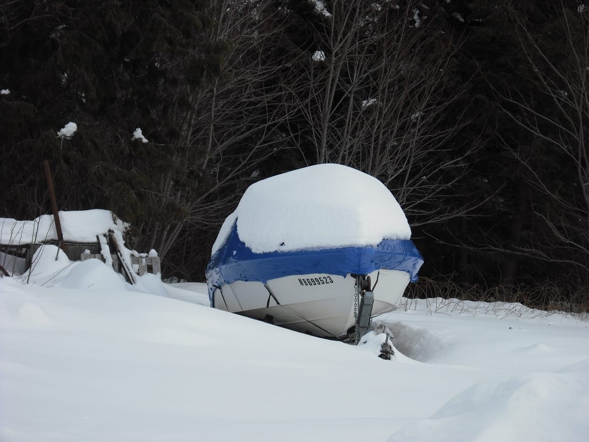 shrink wrapping boats in snow - tufcoat